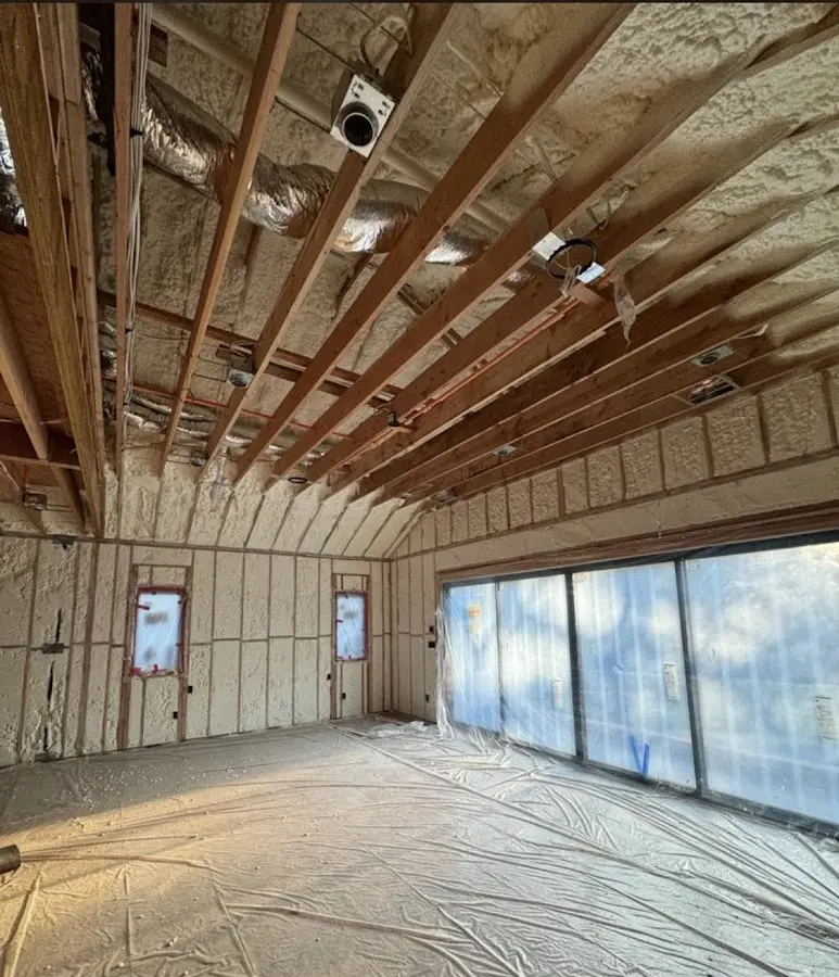Interior walls and ceiling insulated with spray foam during new construction in Matawan
